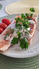lunch or breakfast with pancakes rolls and cherry tomatoes and herbs