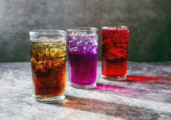A lot of Soft drinks in colorful and flavorful glasses on the table,Glasses with sweet drinks with...