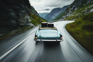 Fototapeta premium A classic convertible travels along a curvy mountain road surrounded by lush greenery and rocky cliffs. Dark clouds loom overhead, suggesting an approaching storm.