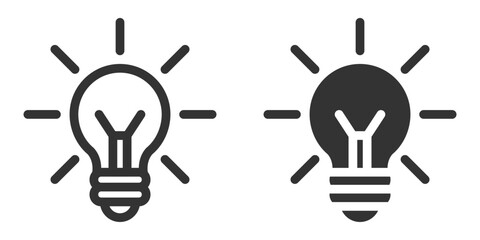 Vector icon of classic lightbulb with glowing lines.