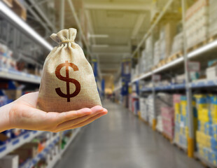 Dollars money bag on the background of a grocery store counter with products food. Concept of cost...