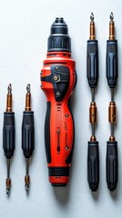 High-angle close-up shot of a red electric screwdriver with multiple bits