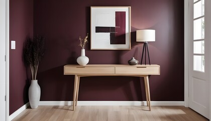 Minimalist foyer featuring a console table in bright wooden color, dark burgundy wall, contemporary minimalist artwork hanging on the wall, with light wooden parquet flooring