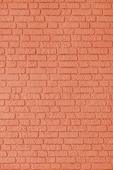 Obraz premium Orange color painted old brick wall texture, architecture brickwork building, masonry of stone blocks structure. Design element, wallpaper, vertical background, banner, header.