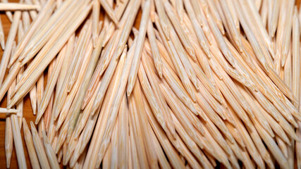 Toothpicks arranged in an artistic pattern on a wooden surface