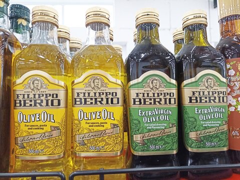 Variety of filippo berio olive oil bottles on store shelf
