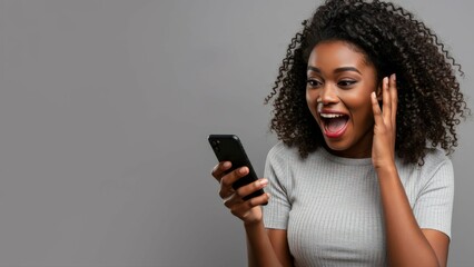Wow, news and excited black woman with phone in studio for online competition giveaway on grey background. Yes, smartphone and happy female model with app notification of sign ups winner or prize