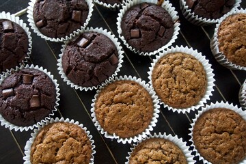 Chocolate and vanilla muffins on a cooling rack