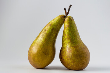 Conference pears on a light background, horizontal.