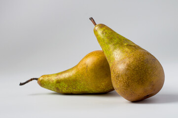 Conference pears on a light background, horizontal.