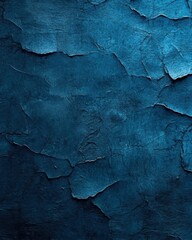 Obraz premium Deep blue textured wall with cracks and peeling paint creating a dramatic and artistic background for design projects