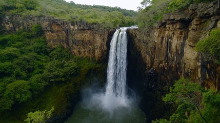 Obraz premium Majestic waterfall cascading through lush forest nature photography aerial view tranquil environment