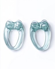 Fototapeta premium Pair of light teal, rounded, silicone ear-shaped sleep aids