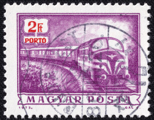 Hungarian stamp from 1973 featuring a diesel mail train.