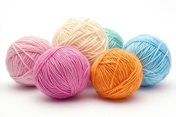 Colorful yarn balls in soft pastel hues against a white background.