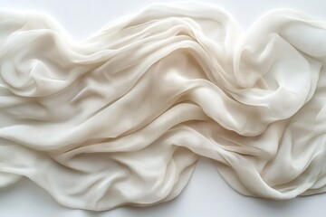 Fototapeta premium Soft cream fabric draped elegantly on a smooth surface showcasing delicate texture and flowing lines