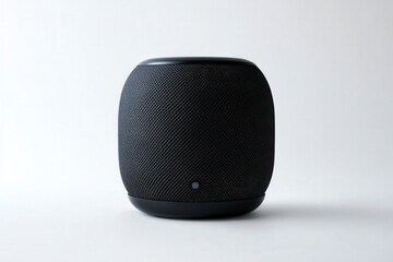 Obraz premium Sleek black smart speaker with a minimalistic design.