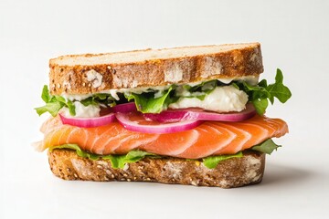 Fresh salmon sandwich with greens and onions on rustic bread.