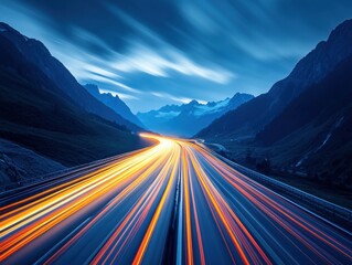 Dynamic highway at twilight with blurred car lights cutting through the mountain landscape in a long exposure shot for travel and adventure