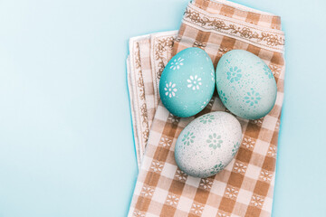 Easter background, easter eggs on light blue background. Festive easter decoration