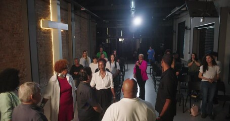 Congregation participating in prayer and worship, focused on spiritual connection, leader guiding service in modern evangelical church setting