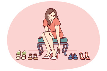 Shopaholic woman is trying on shoes in store choosing right high heels for going to party. Girl visitor of fashion boutique with shoes who loves shopping and wants to change wardrobe