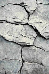 Obraz premium Granite Rock as Natural Backdrop, Cracked stone surface with a textured, natural appearance.