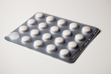 A pack of medical pills on a white background