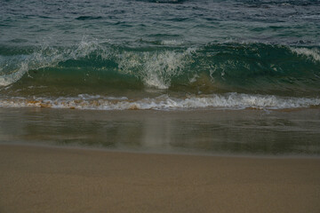 Peaceful Seaside Scene with Soft Waves and Golden Sand