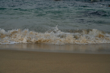 Peaceful Seaside Scene with Soft Waves and Golden Sand