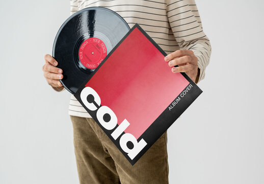 Mockup Of Man Putting Customizable Vinyl Lp In Cover