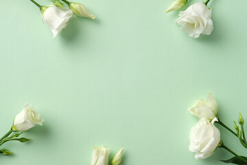 White lisianthus flowers on a pastel green background. Minimalist and elegant design, perfect for invitations, floral ar