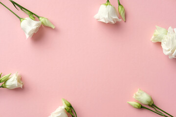 Elegant white lisianthus flowers on a pastel pink backdrop. Perfect for romantic, wedding, or spring concepts