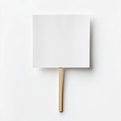 Blank paper sheet on wooden stick against white background