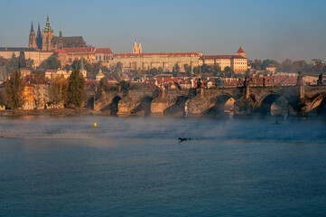 Obraz premium Prague, Czech Republic, Central Bohemia, Charles Bridge, Karluv Most on the Vltava River, in the background the castle district of Hradcany St. Vitus Cathedral, Katedrála svatého Víta