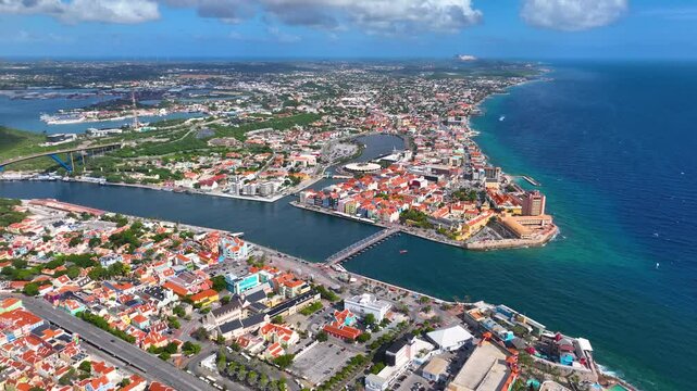 Willemstad historic city center aerial view including Otrobanda on the left and Punda on the right in city of Willemstad, Curacao. Historic Willemstad is a UNESCO World Heritage Site. 