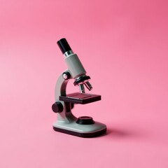 Close-up of mini microscope on pink background, technology, education