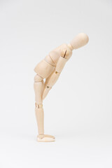 お辞儀をするデッサン人形