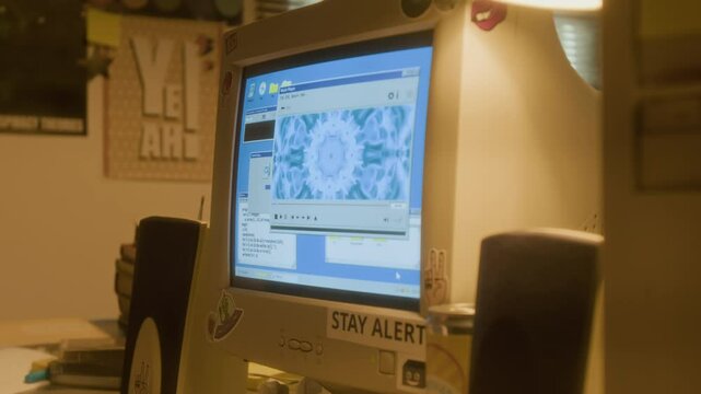Closeup shot of childs hand turning up volume on retro speakers and listening to music in nostalgic 90s setting with music visuals on computer screen, copy space