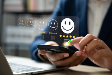 Customer satisfaction survey concept, Businessman using smartphone touch happy smiley icon, 5 star...