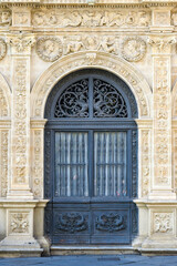 Obraz premium Metalwork entrance door and architectural decorations in the Casa Consistorial or City Hall, Seville, Spain
