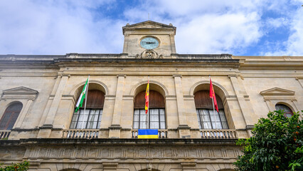 Clock tower in the medieval facade of the City Hall building, Seville, Spain