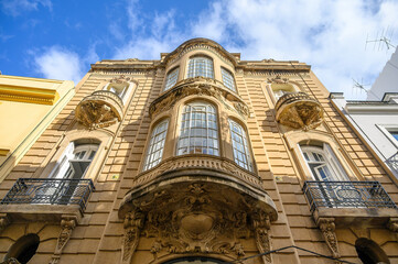 Low angle view of the Art Nouveau facade in Seville, Spain