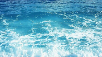 Pure blue turquoise water texture of the ocean sea with foam from and waves

