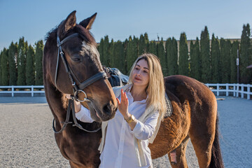 Woman with a horse, countryside place, lady talking to her horse. Portrait of riding horse with woman at rancho