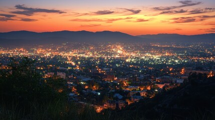 Obraz premium Sunset Cityscape: A Panoramic View of a Vibrant City at Dusk