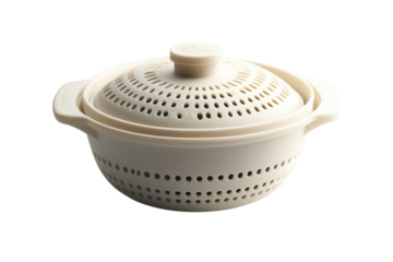 An elegant steamer pot ready to cook healthy meals in a modern kitchen with minimalist studio lighting on black.