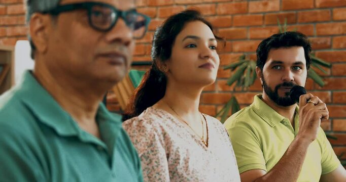 Indian Asian young business professionals or startup team attending a corporate training session, engaging in an interactive leadership lecture, asking questions, sharing insights in conference room