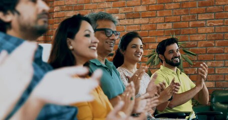 Indian Asian young business professionals or startup team clapping and applauding after an inspiring corporate talk, leadership lecture, or educational training session in a modern conference room