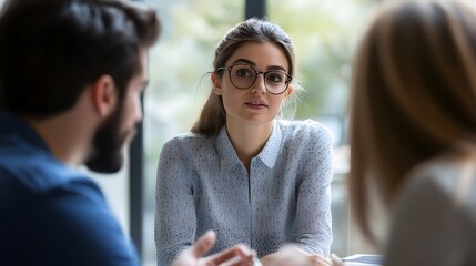 Focus and Insight: a smart businesswoman with glasses actively engages in a dialogue, highlighting her intelligence and attentiveness.
